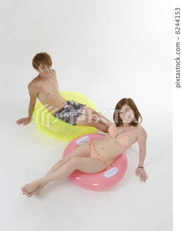 Young couple in bathing suits Young couple in bathing suits 8244153