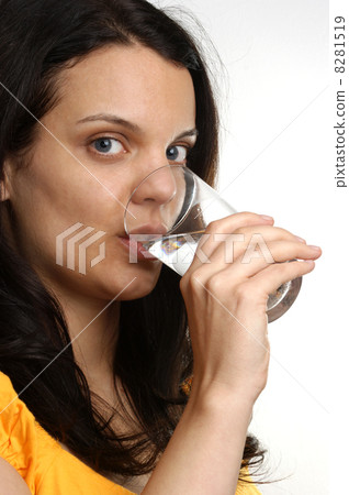 a young woman drinks organic cold milk 8281519