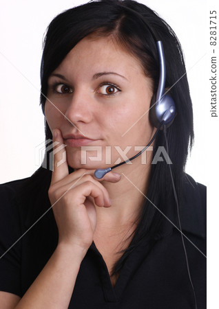 a young woman with closed mouth and headset a young woman with closed mouth and headset 8281715