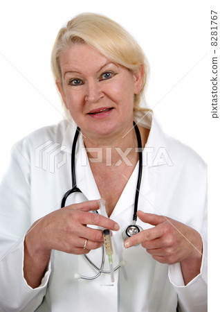 medical assistant points to a syringe in her hand medical assistant points to a syringe in her hand 8281767
