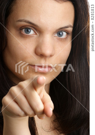 a young woman show with her fingertip a young woman show with her fingertip 8281813