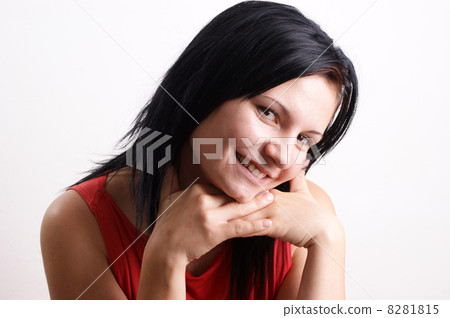 a young woman smiles into a digital camera 8281815