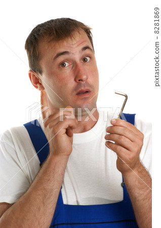 Craftsmen in blue overalls holding an allen key 8281869