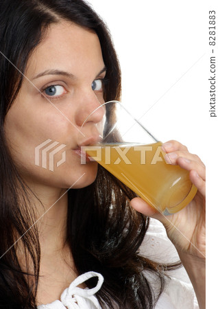 a young woman drinks some cold juice a young woman drinks some cold juice 8281883