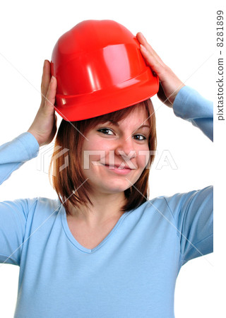 young woman holds a red safety helmet 8281899