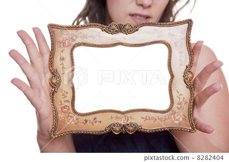 Woman holding an picture frame 8282404