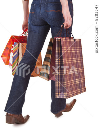 Happy woman holding shopping bags Happy woman holding shopping bags 8283547