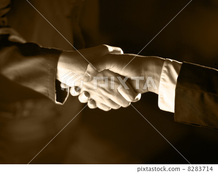 Handshake Handshaking and light, sepia 8283714