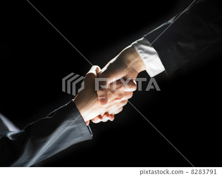 Handshake Handshaking on light and dark Handshake Handshaking on light and dark 8283791