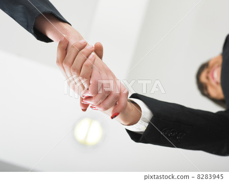Handshaking in office low angle Handshaking in office low angle 8283945