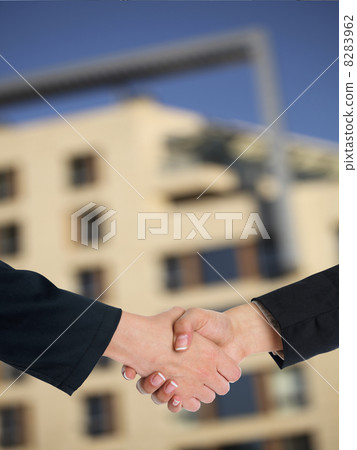 Architectural Handshaking in front of building 8283962
