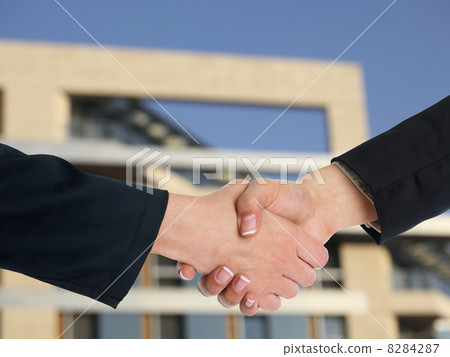 Architectural Handshaking in front of building 8284287
