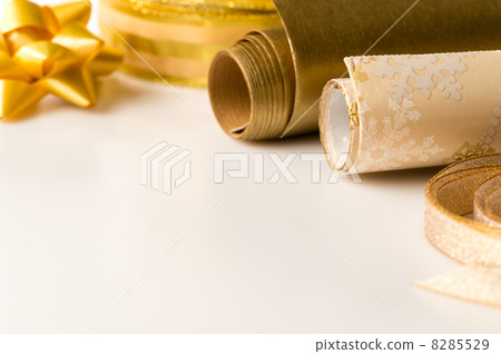Gold wrapping paper and bow Christmas decoration Gold wrapping paper and bow Christmas decoration 8285529