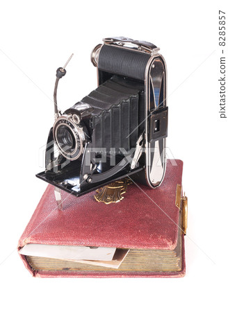 Vintage photography camera with old photoalbum 8285857