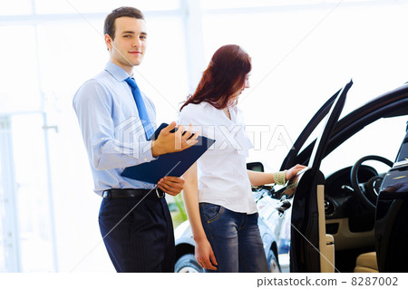 Young woman at car salon 8287002