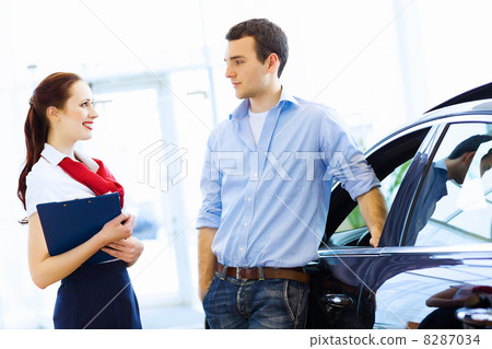 Young man at car salon 8287034