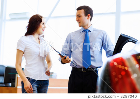 Young woman at car salon 8287040