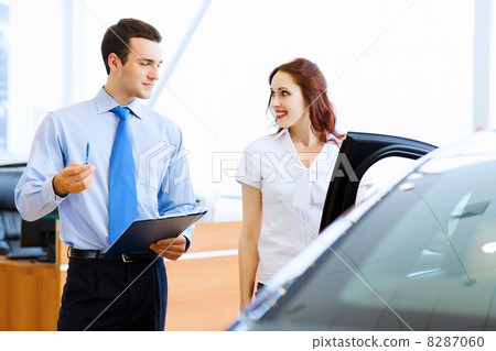 Young woman at car salon 8287060