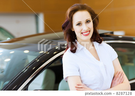 Young lady at car salon Young lady at car salon 8287128