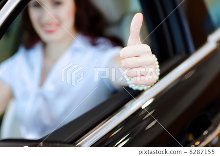 Young woman in car Young woman in car 8287155
