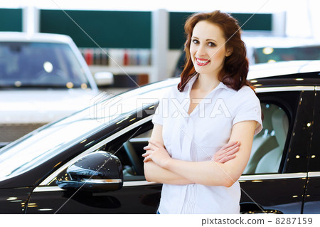 Young lady at car salon Young lady at car salon 8287159