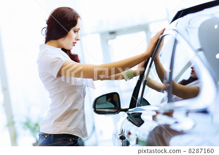 Young lady at car salon Young lady at car salon 8287160