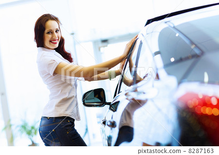 Young lady at car salon Young lady at car salon 8287163