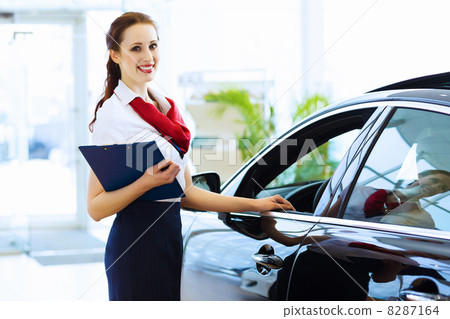 Woman consultant at car salon 8287164
