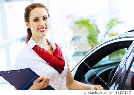 Woman consultant at car salon Woman consultant at car salon 8287167
