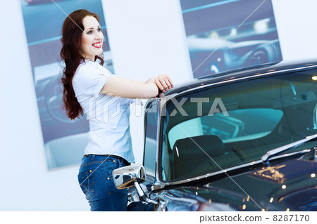 Young lady at car salon Young lady at car salon 8287170