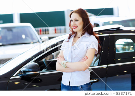 Young lady at car salon Young lady at car salon 8287171