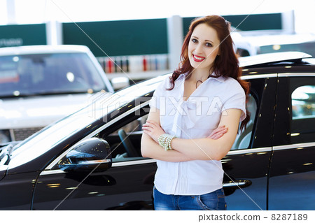 Young lady at car salon Young lady at car salon 8287189