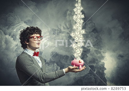 Young businessman holding moneybox Young businessman holding moneybox 8289753