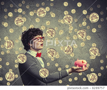 Young businessman holding moneybox Young businessman holding moneybox 8289757