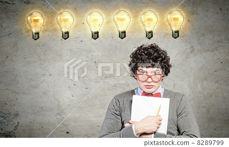 Young man with papers and light bulb Young man with papers and light bulb 8289799