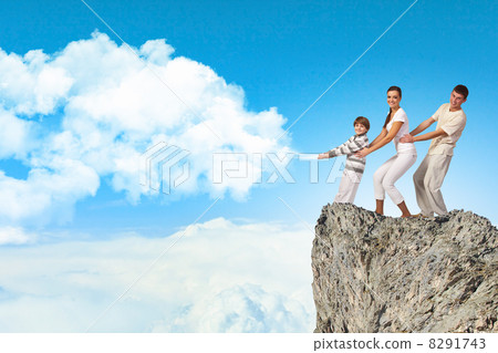 Young family pulling banner 8291743