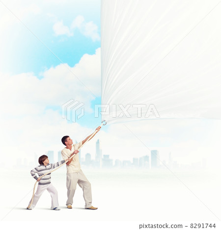 Young family pulling banner 8291744