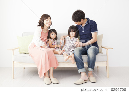 Family sitting on the sofa 8296708