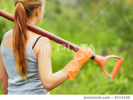 Woman working in the garden Woman working in the garden 8314198