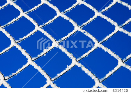 abstract winter background from a lattice against the blue sky abstract winter background from a lattice against the blue sky 8314420