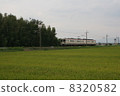 Two-cap line 107 train going through the countryside 8320582