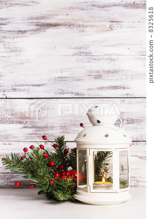 Cristmas lantern with fir and berries Cristmas lantern with fir and berries 8325618