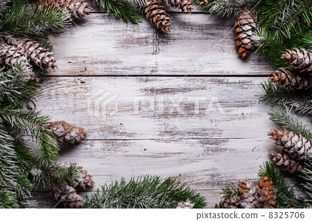 White shabby Christmas border with snow covered pinecones White shabby Christmas border with snow covered pinecones 8325706