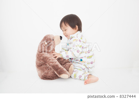 A stuffed animal and a boy 8327444