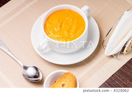 Sweet Pumpkin porridge in white bowl at the table 8328062