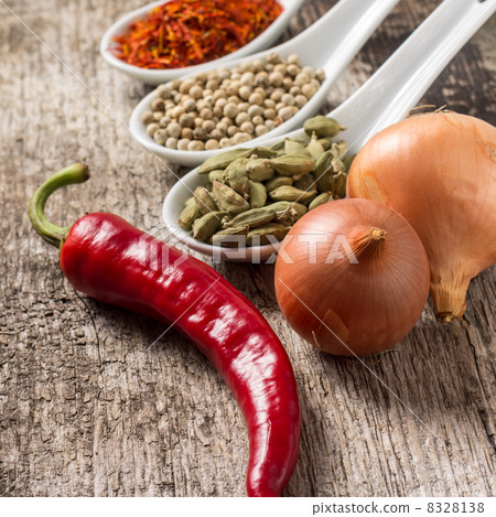 Close up photo of spices with chili pepper and onion Close up photo of spices with chili pepper and onion 8328138