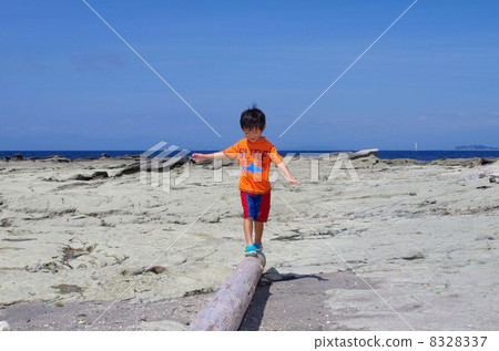Children playing with driftwood Children playing with driftwood 8328337