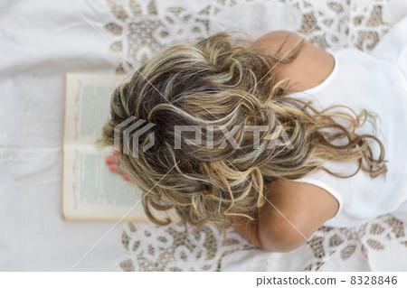 Beautiful girl with book on the floor 8328846