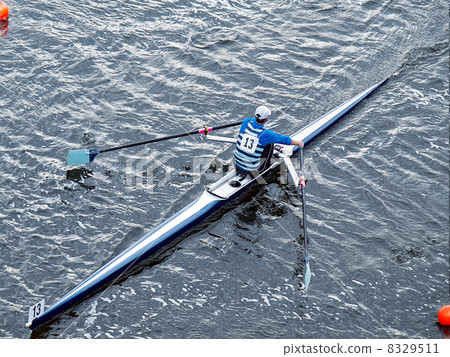 Man rowing in boat on water Man rowing in boat on water 8329511
