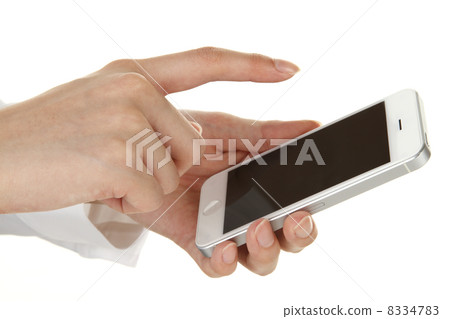 A young woman handling a smartphone A young woman handling a smartphone 8334783